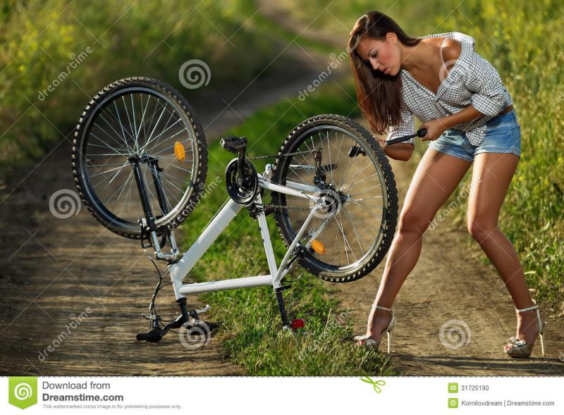 sexy-biker-bicycle-has-flat-tyre-woman-pump-up-31725190.jpg